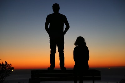 Bench stood the man and woman sitting silhouette
